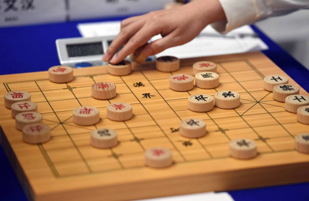 Personnes jouant aux &eacute;checs chinois